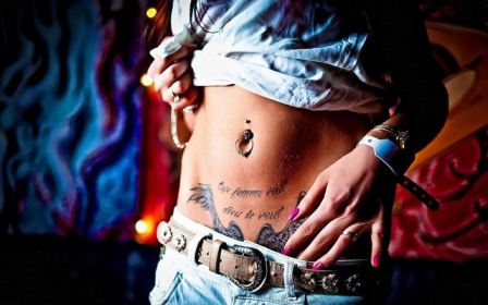 Raised Shirt Tattoos Woman Pierced Toned Belly