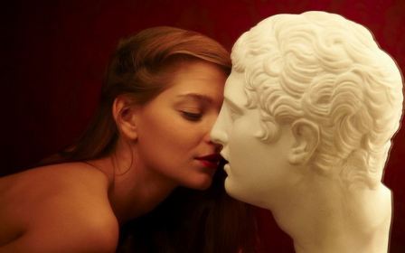 Sexy Brunette Kissing Statue