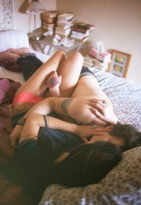 Boy And Girl Cuddling In Bed